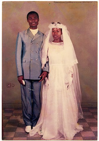 Emmanuel Nshindi and Nicole Nshindi on their wedding day. From a Nshindi family photo album. Photographer unknown. Kinshasa, D.R.C., c. 1975.
