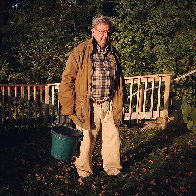 My dad getting ready to feed the birds, an evening ritual since retiring from over 40 years as a band director. 