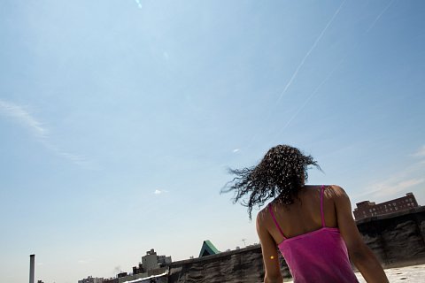 <p>Melanie takes a walk on the roof of her apartment building.</p> <p>The Bronx, July 2015</p>