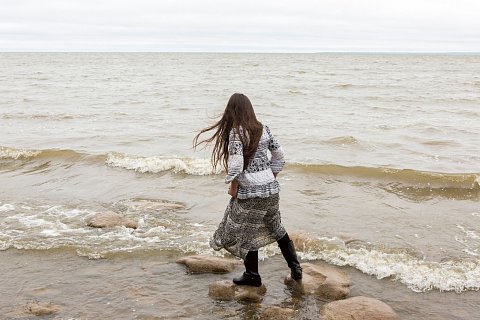 Oliva Elm, 8, from Onondaga Nation plays on the shore of Red Lake on the Red Lake Indian Reservation in northern Minnesota. Elm is visiting with her family to participate in the second annual Red Lake Food Summit. <br>September  2017.