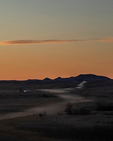 A car leaves a trail of dust on the Cheyenne River Reservation, a sovereign Lakota nation in South Dakota. Covering roughly 4,200 square miles (10,900 square kilometers), it is the fourth largest reservation in the country. 